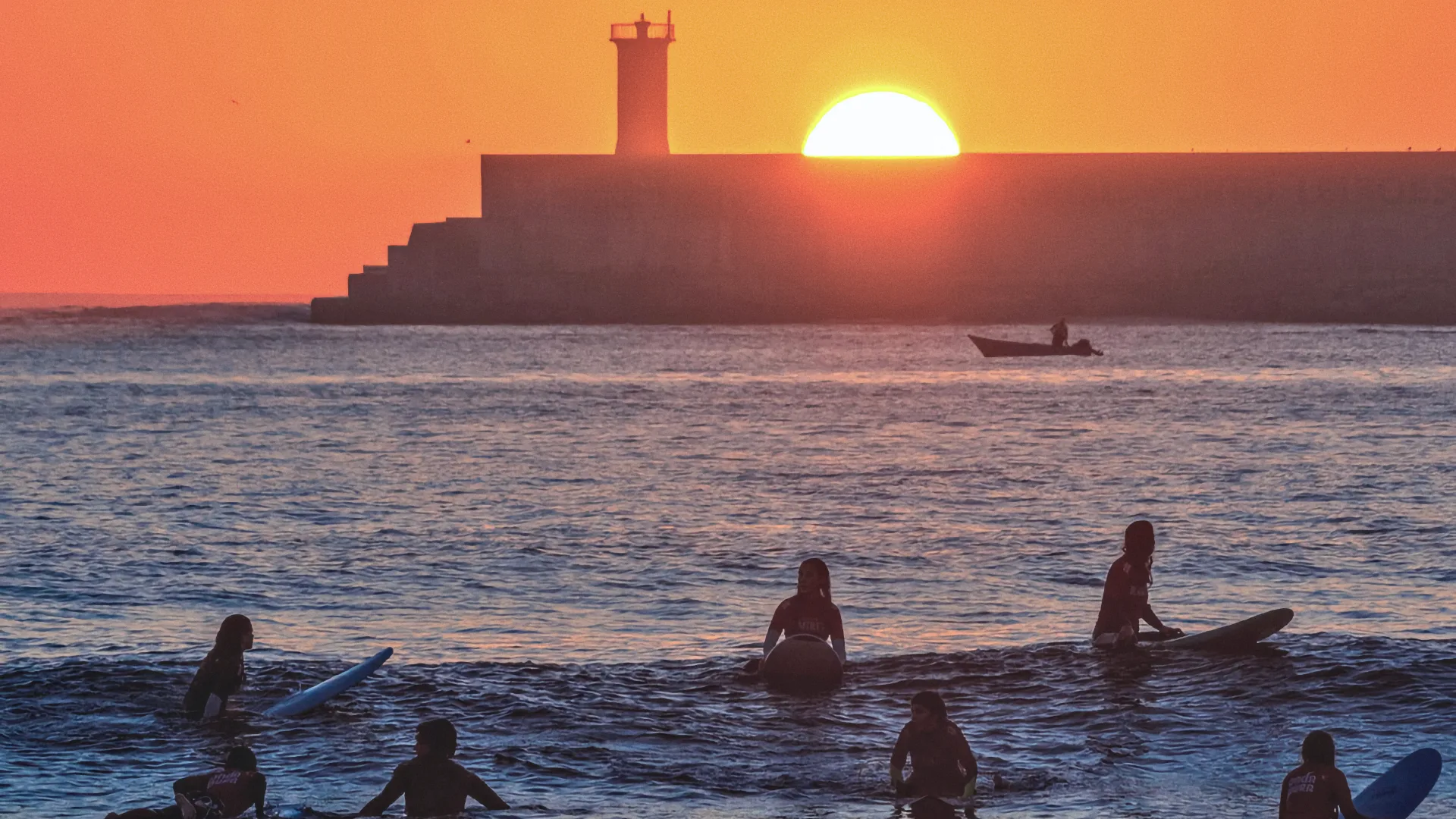 Surfing at sunset in Porto