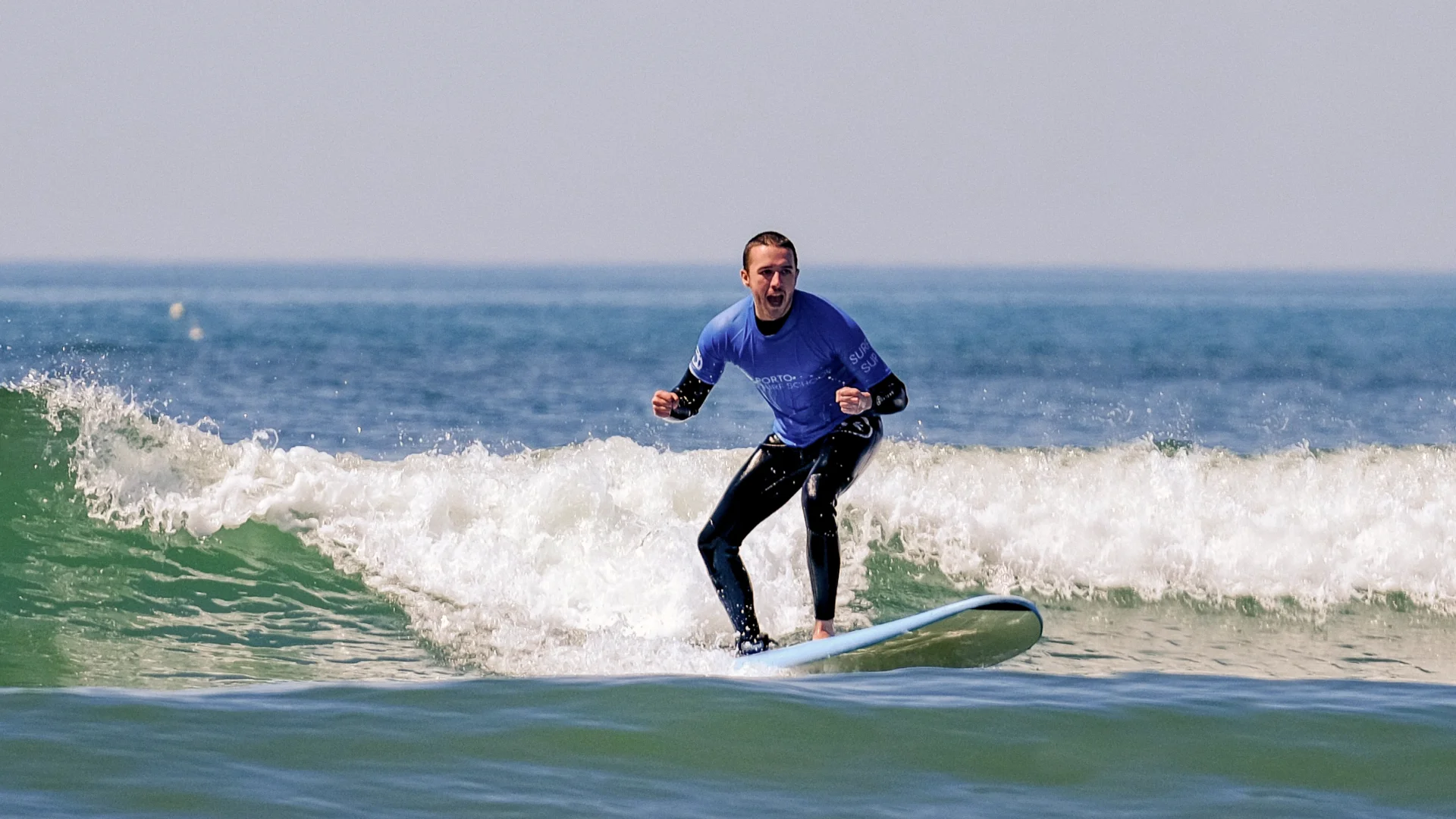 Porto Surf School - Surf student riding a wave